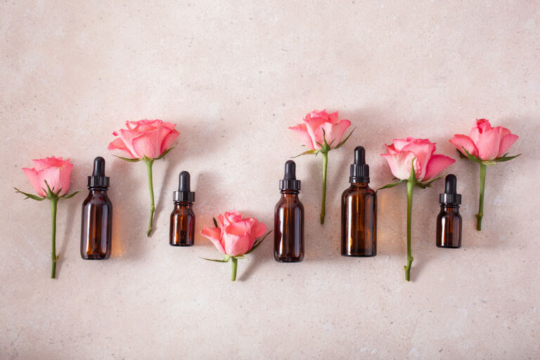 essential oils in bottles rose flowers. alternative medicine aro